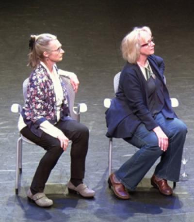 Melanie Bales and Candace Feck spot something to their left.