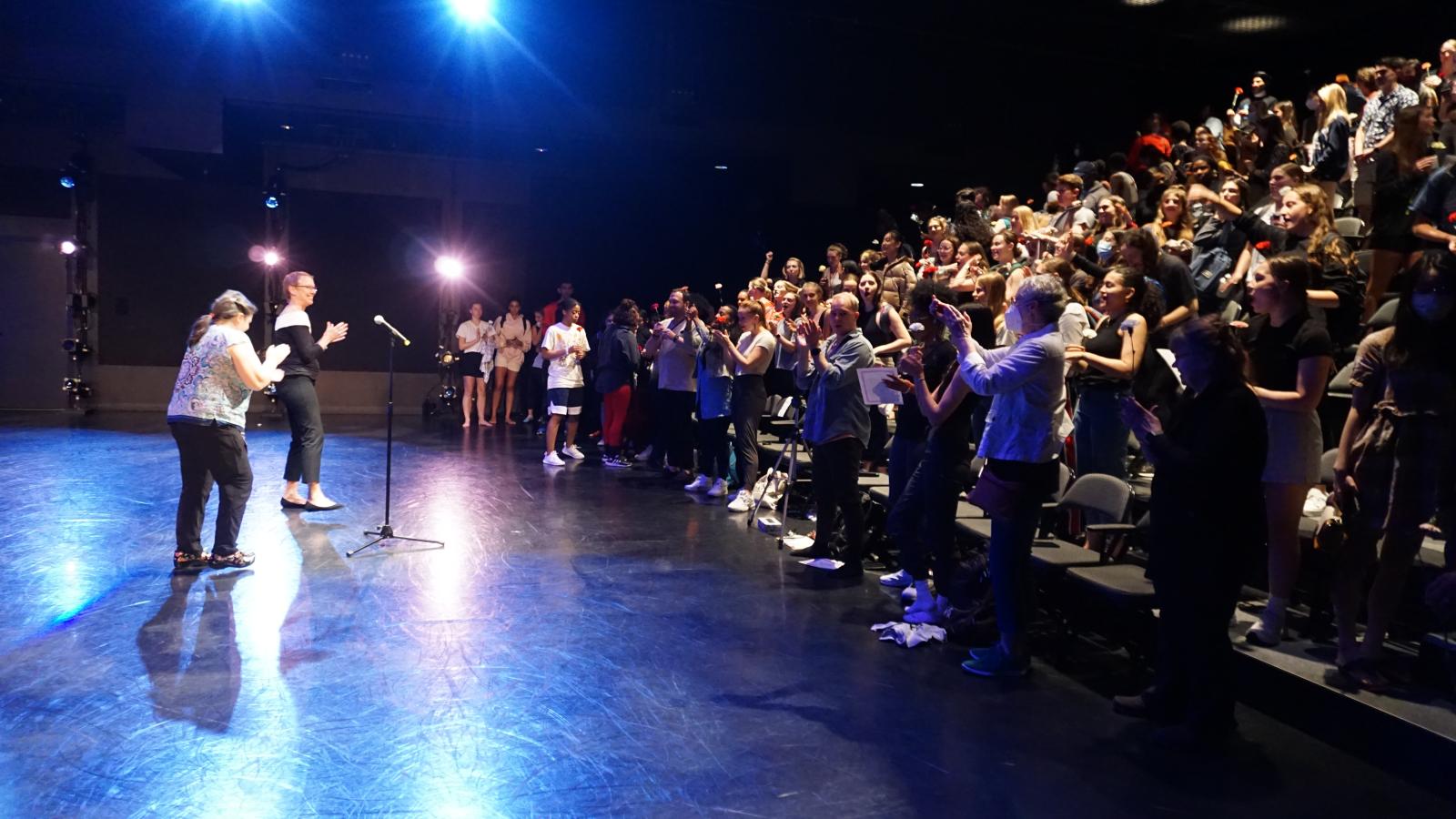 Students applauding Susan Van Pelt Petry