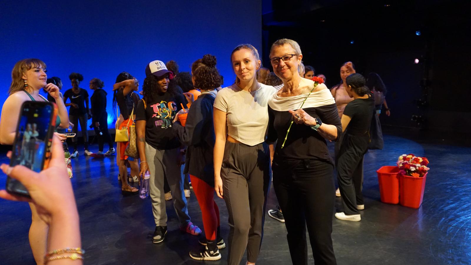 Students give flowers to Susan Van Pelt Petry