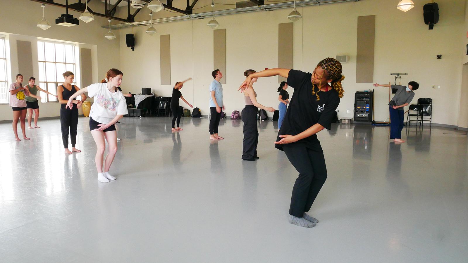 Dancers moving in a studio