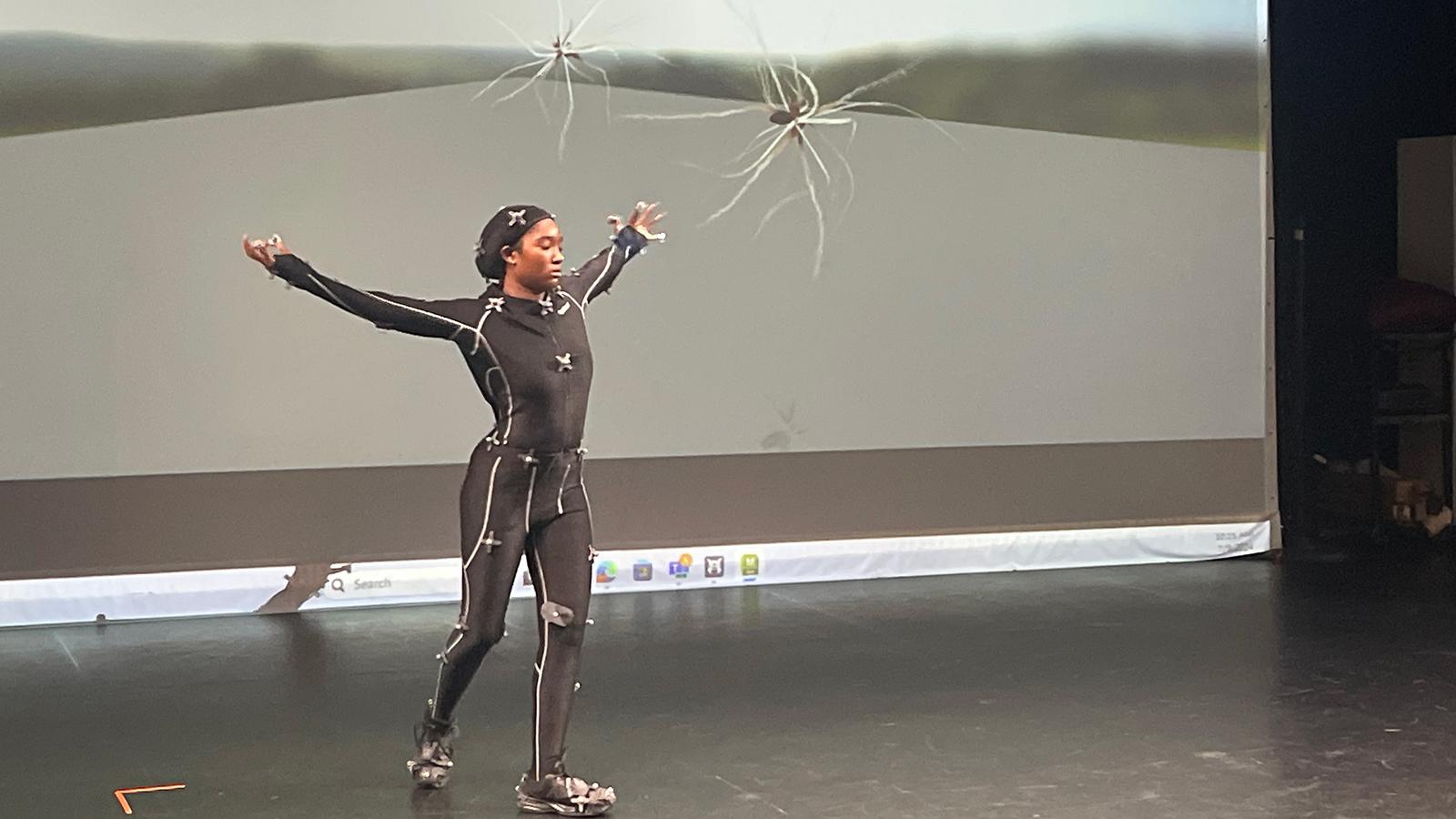 Dancers in motion capture suits rehearsing